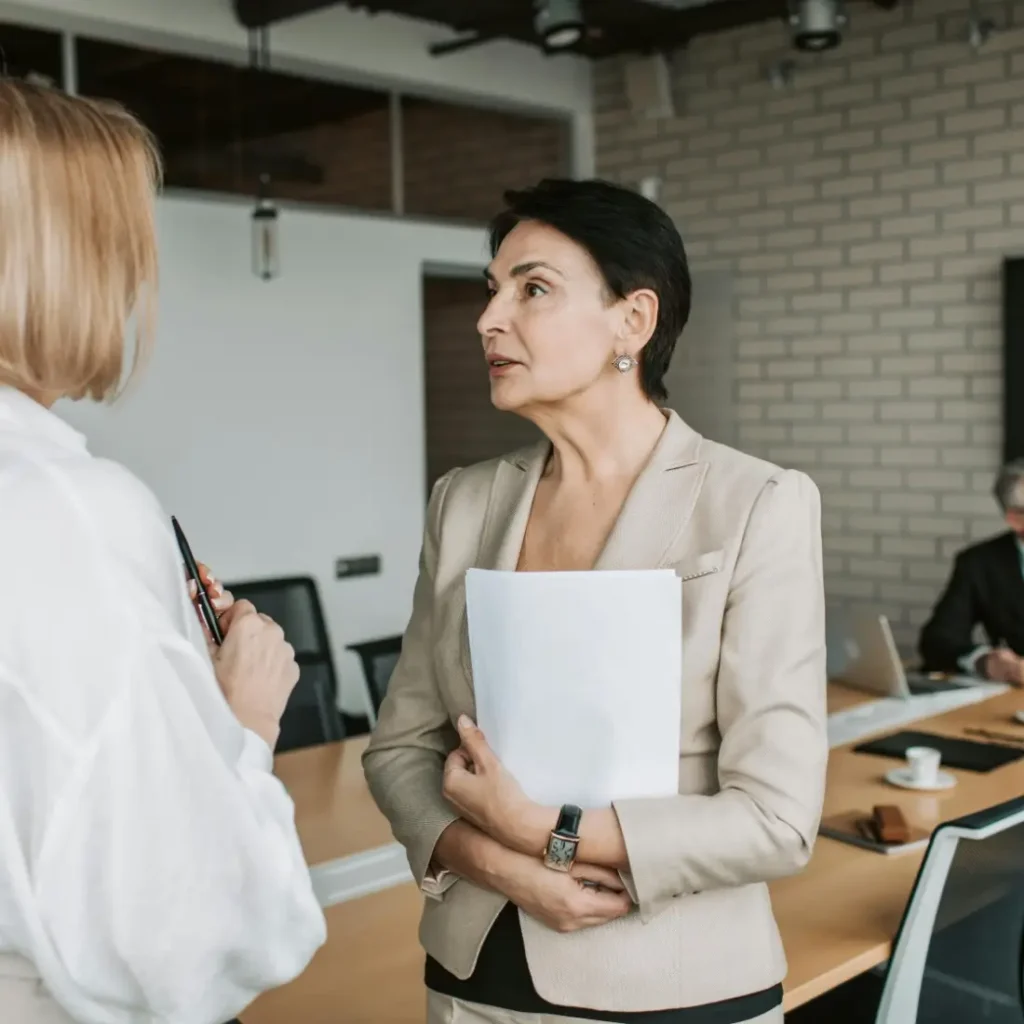 Female financial advisor speaking with event attendees
