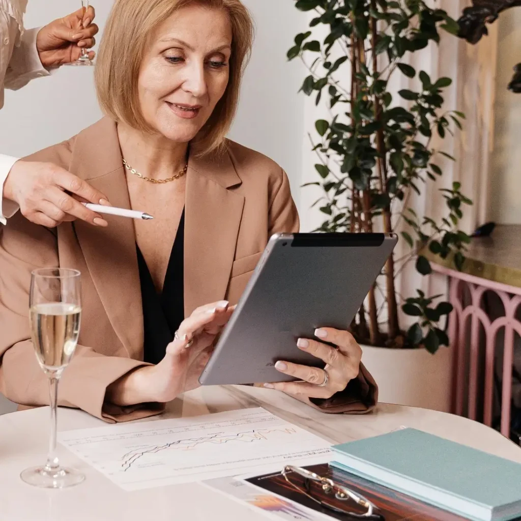 Women discussing financial planning with a tablet
