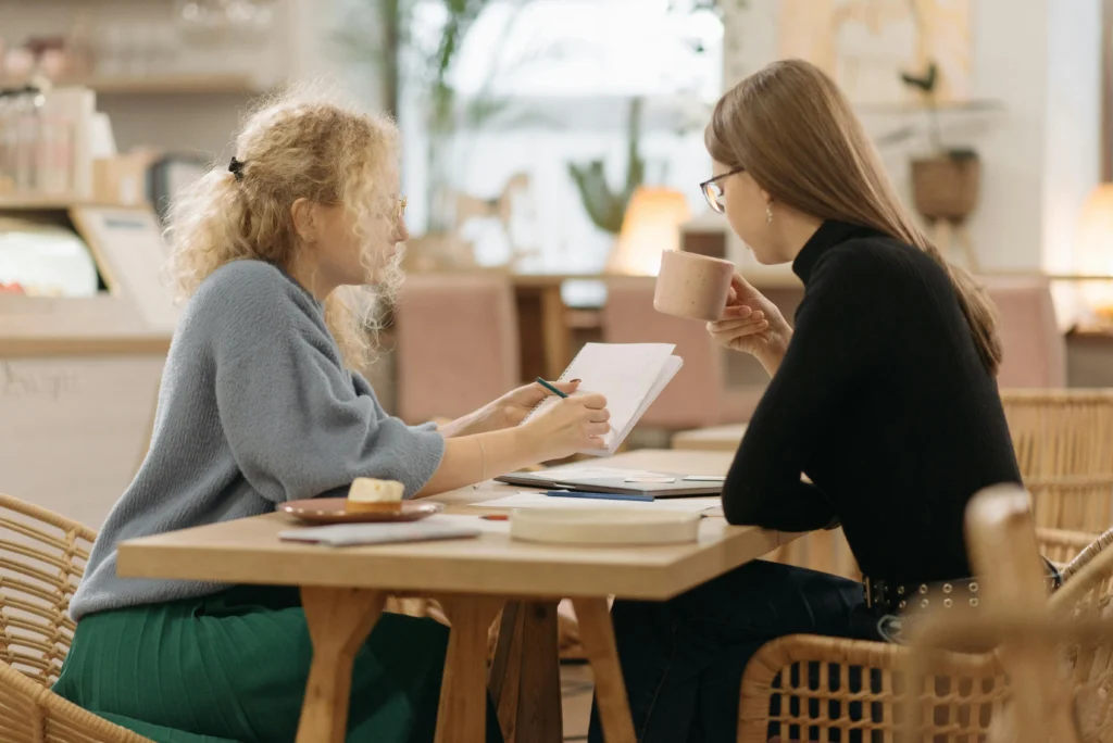 Female financial planners discussing independent firm growth